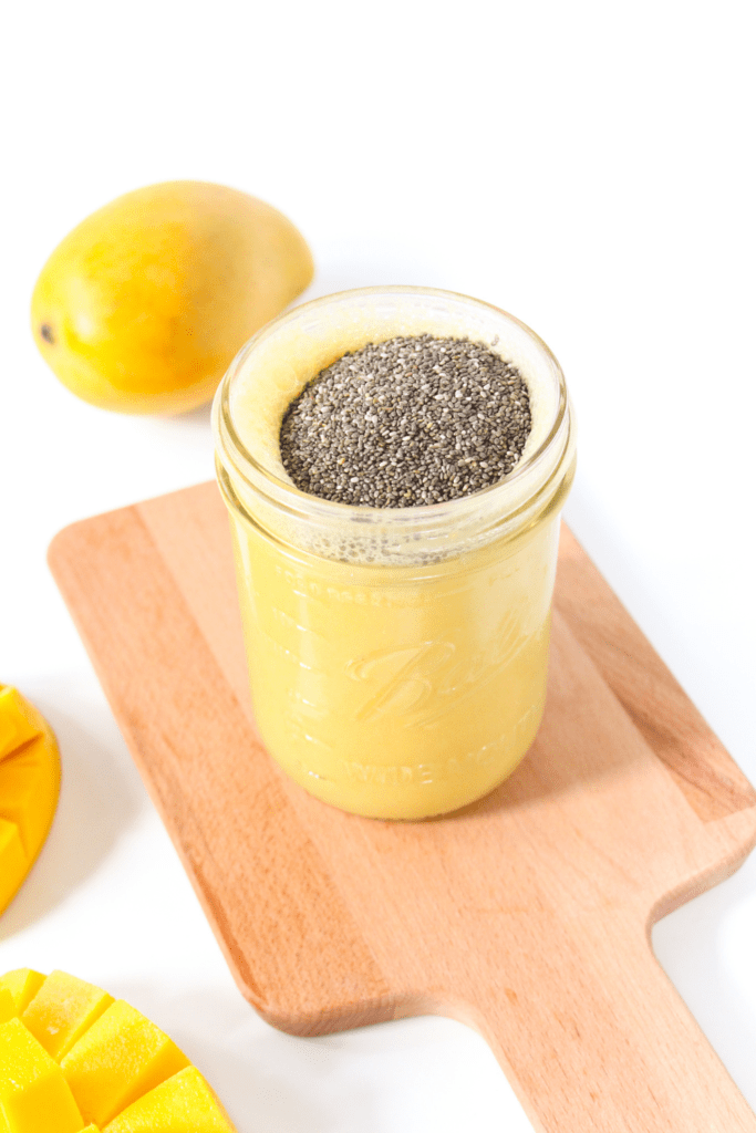 mango pudding with chia seeds on a wooden platter