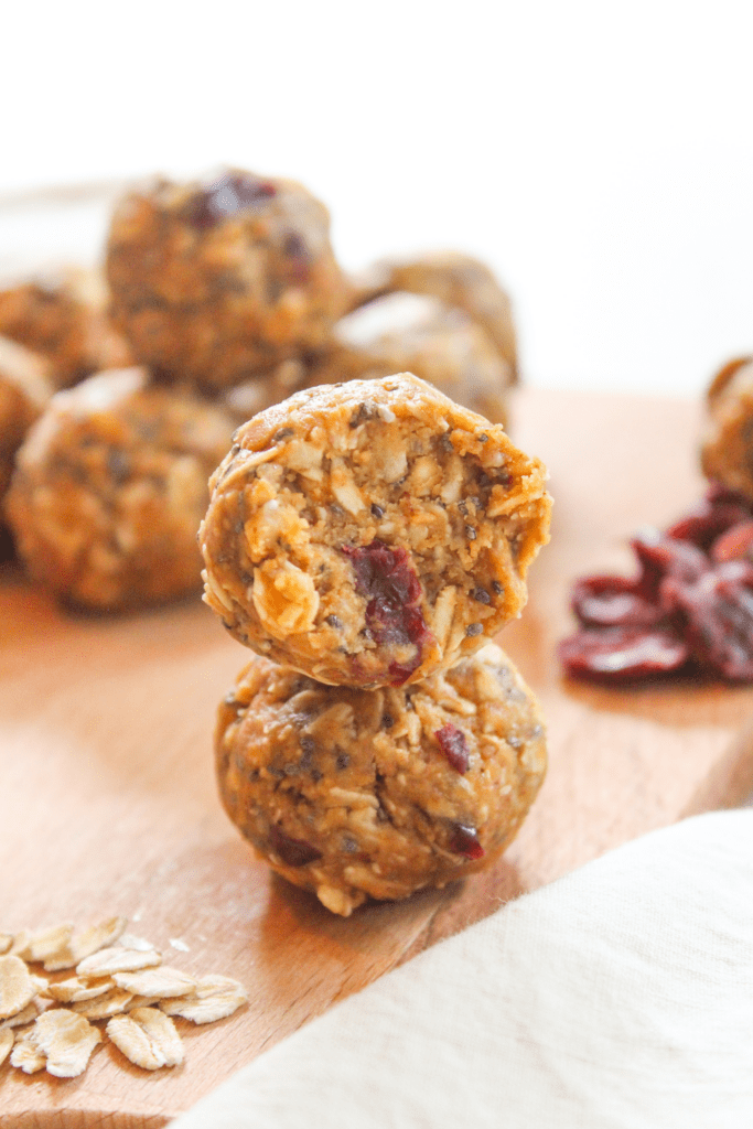 stack of energy balls on a wooden tray