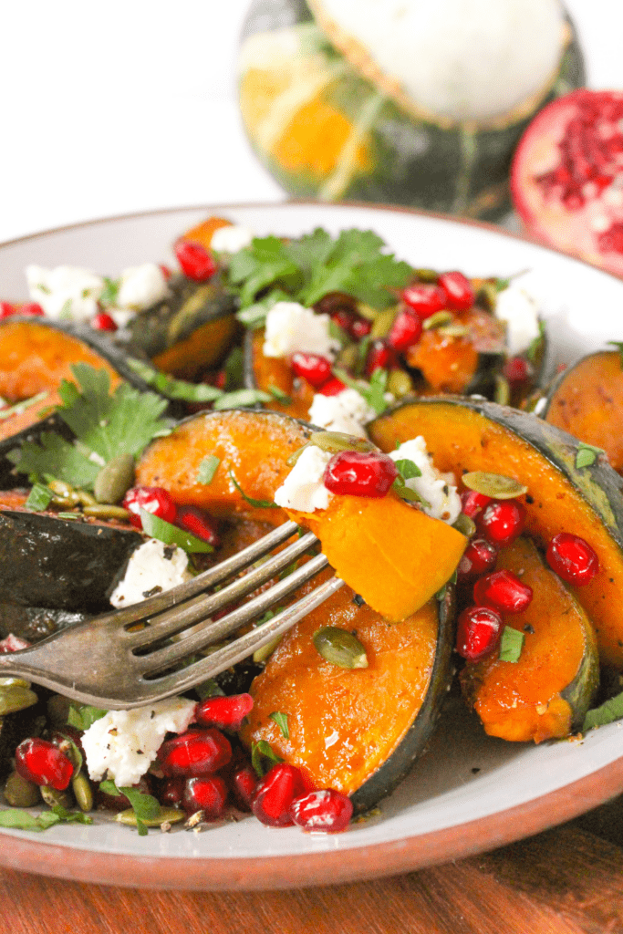 baked buttercup squash with goat cheese and pomegranate seeds
