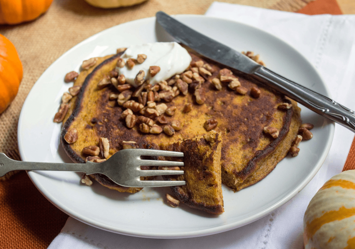 gluten free breakfast pumpkin pancakes with banana on a plate