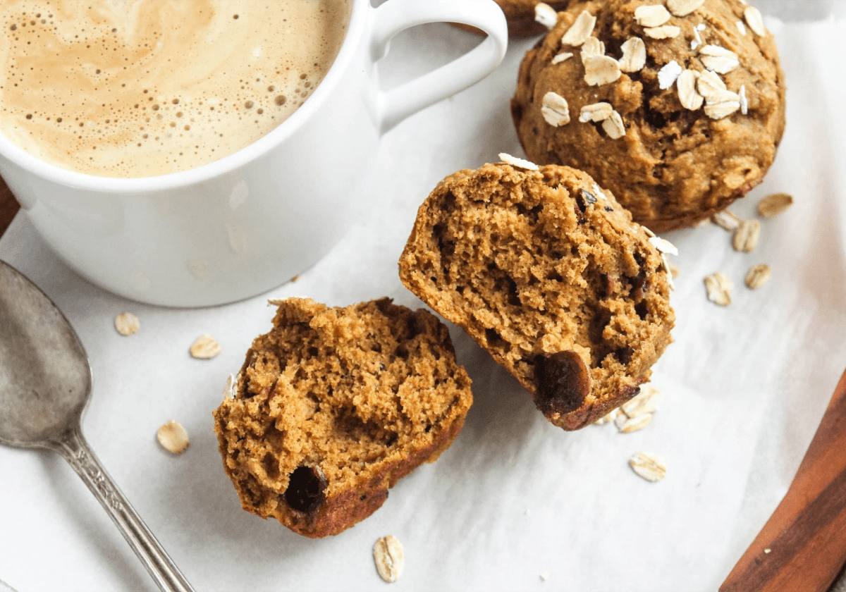 butternut squash muffins with a coffee mug