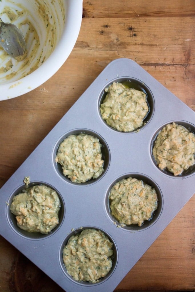 cheddar muffin batter in a muffin tin