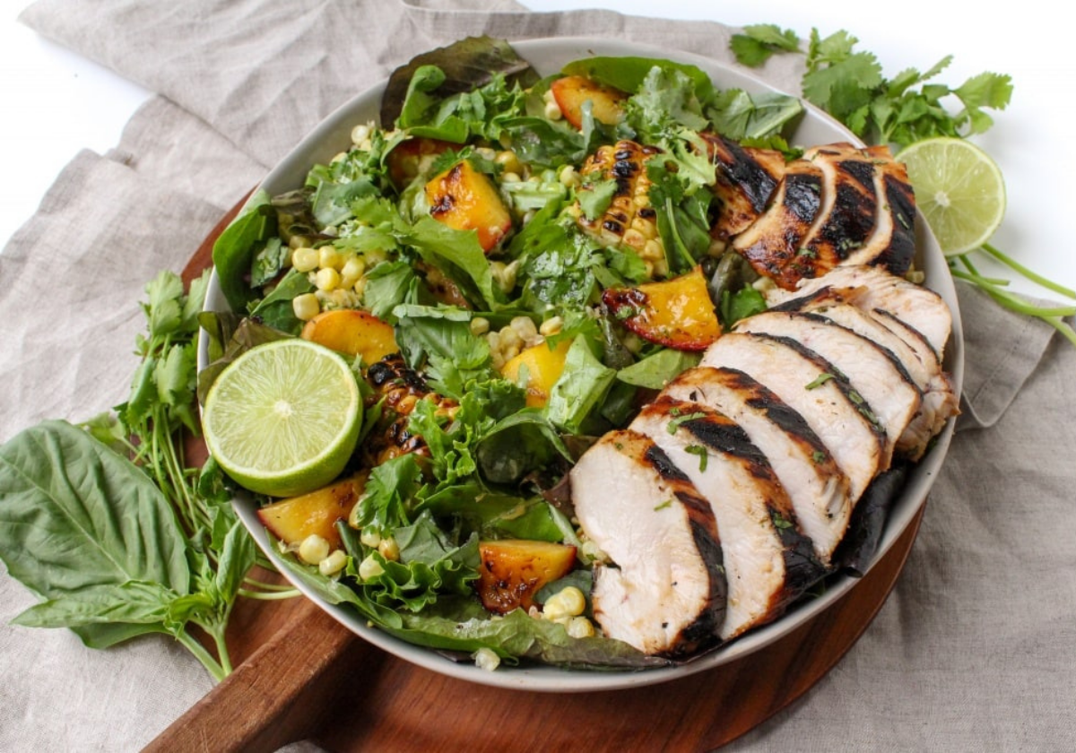 grilled peach, corn, and honey lime chicken salad