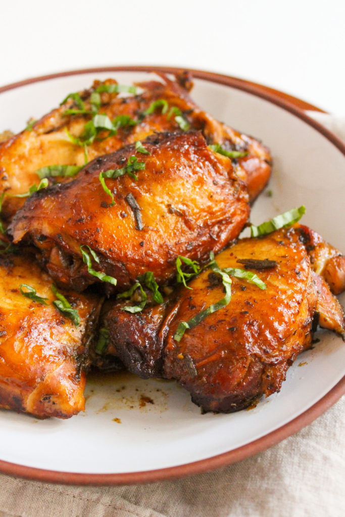 plate of chicken thighs with balsamic glaze