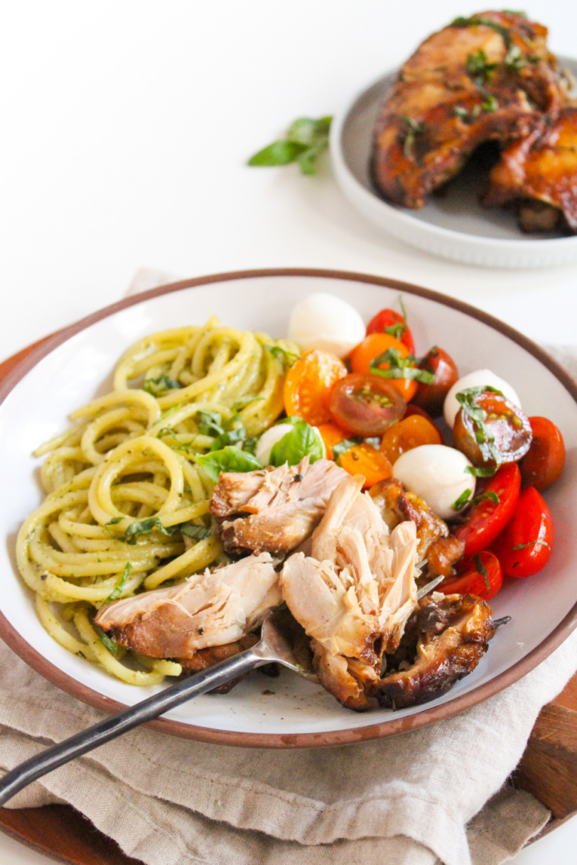 sliced balsamic chicken with pasta and caprese salad