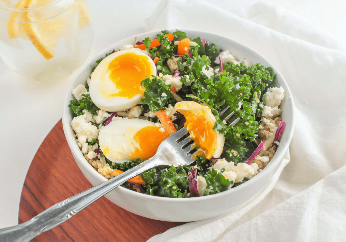 kale and quinoa salad with soft boiled eggs