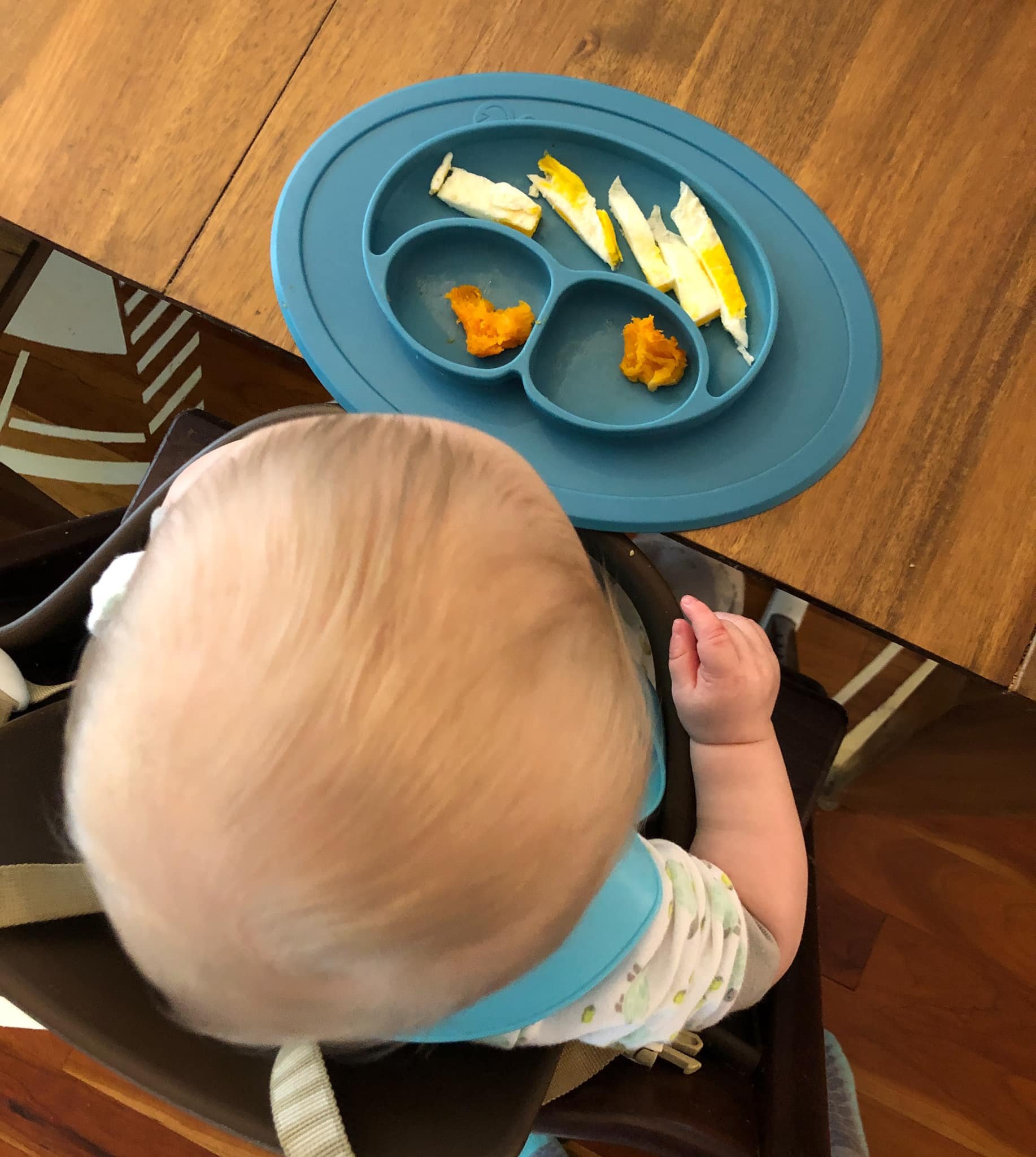 baby eating sweet potato and egg