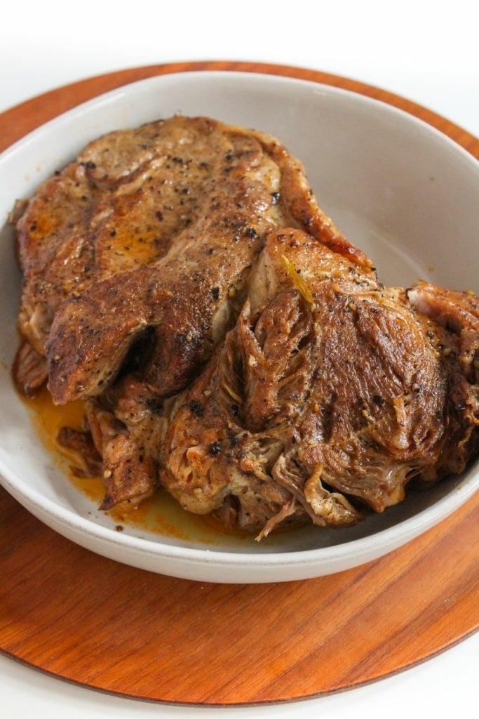 Instant Pot pork roast in a white bowl