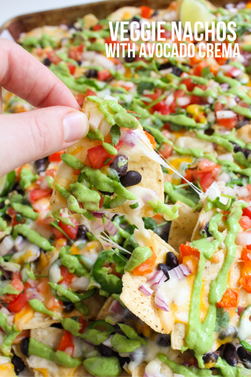 sheet pan loaded vegetarian nachos with avocado crema