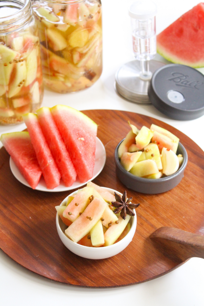 fermented watermelon rind pickles in small bowls