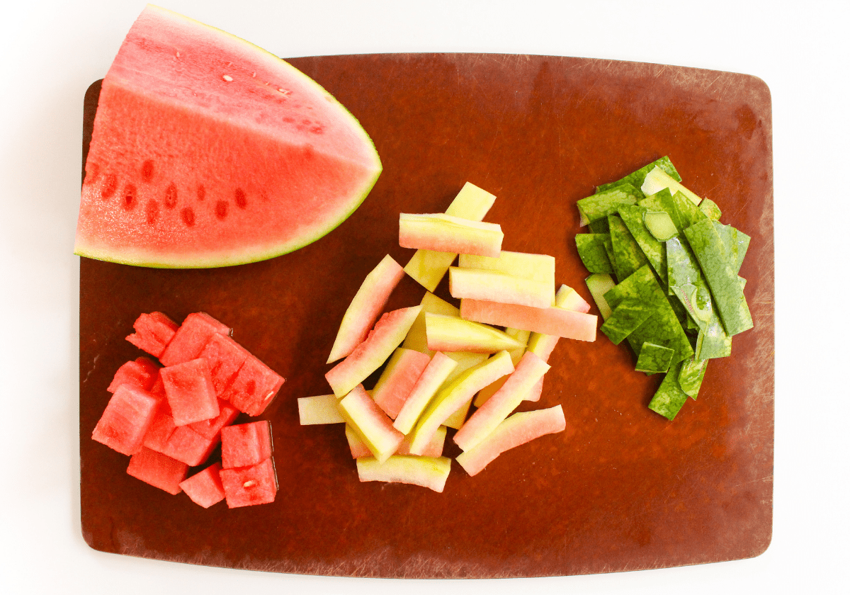sliced watermelon rind on a wooden cutting board