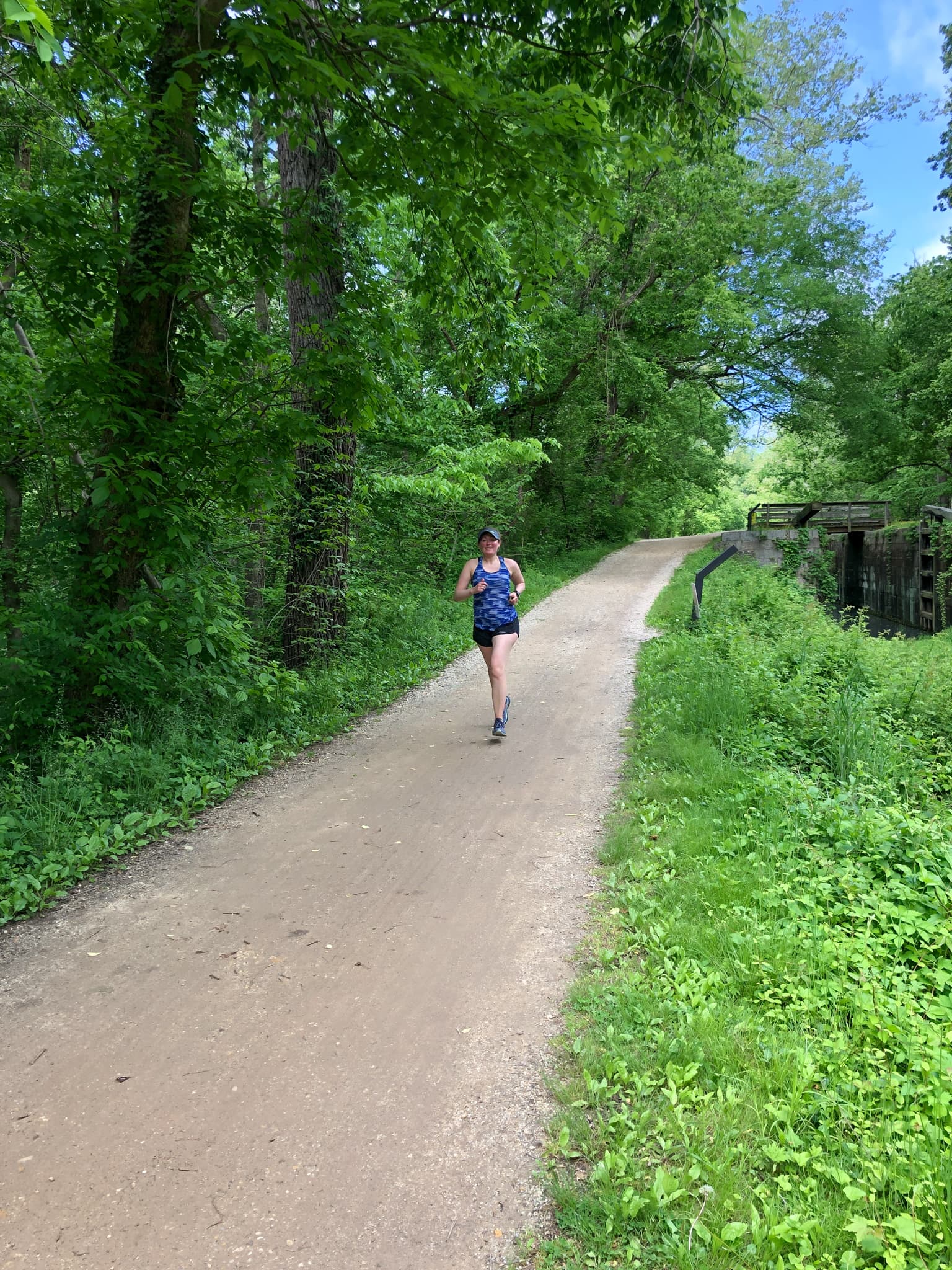 anne mauney running on the c&o canal trail.