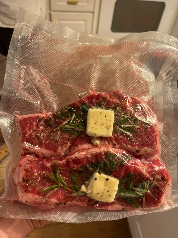 steak topped with butter and herbs