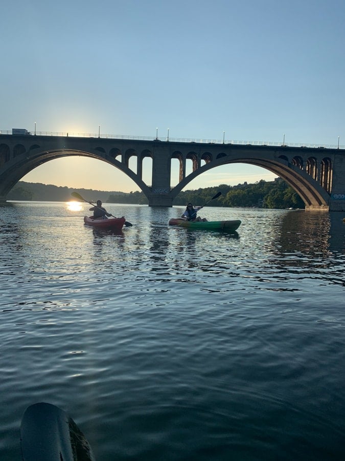 kayaking near key bridge boathouse at dusk