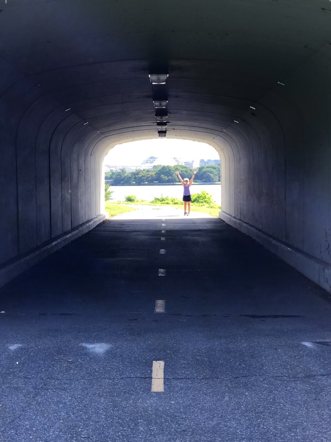 view of runner through a tunnel on mt. vernon trail
