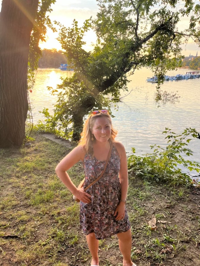anne mauney by the water in georgetown at sunset