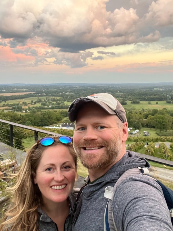anne and matt mauney with a sunset view