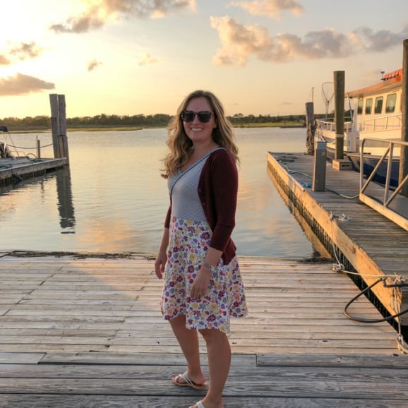 anne mauney with a sunset view on the dock