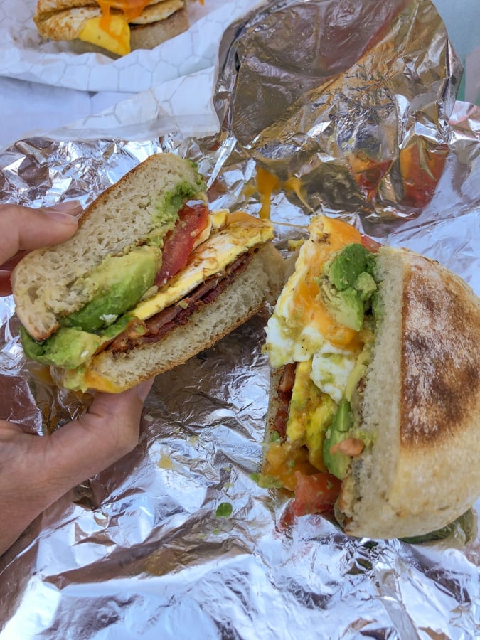 egg, bacon, tomato, cheese, and avocado sandwich from ostara's coffee house