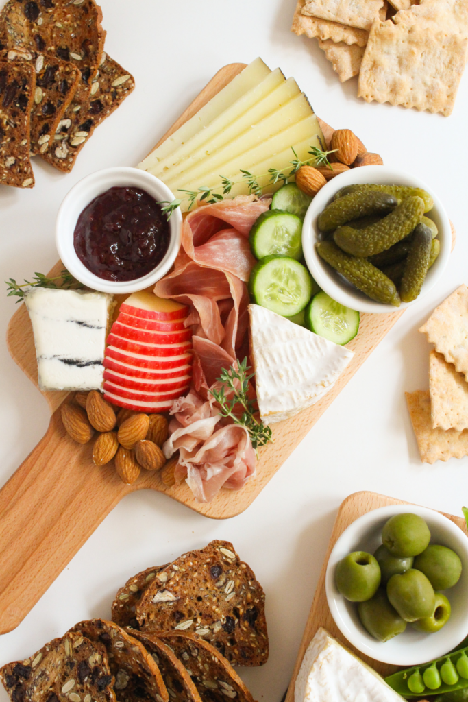 small charcuterie board with pickles and apple slices