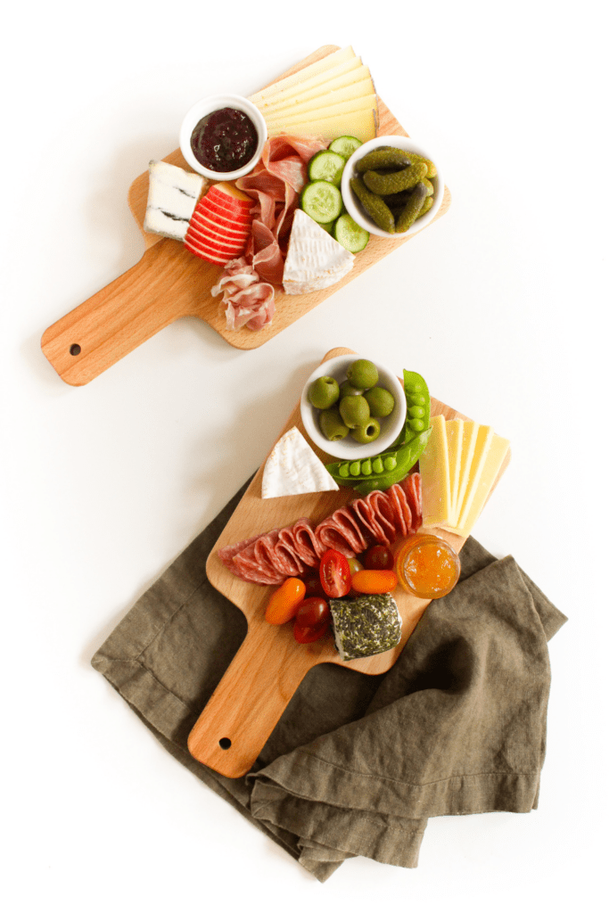 small charcuterie board with apples and vegetables