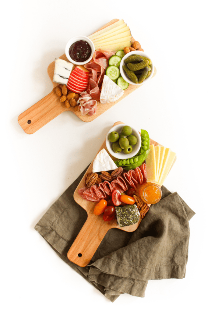 cheese board with nuts and cured meat