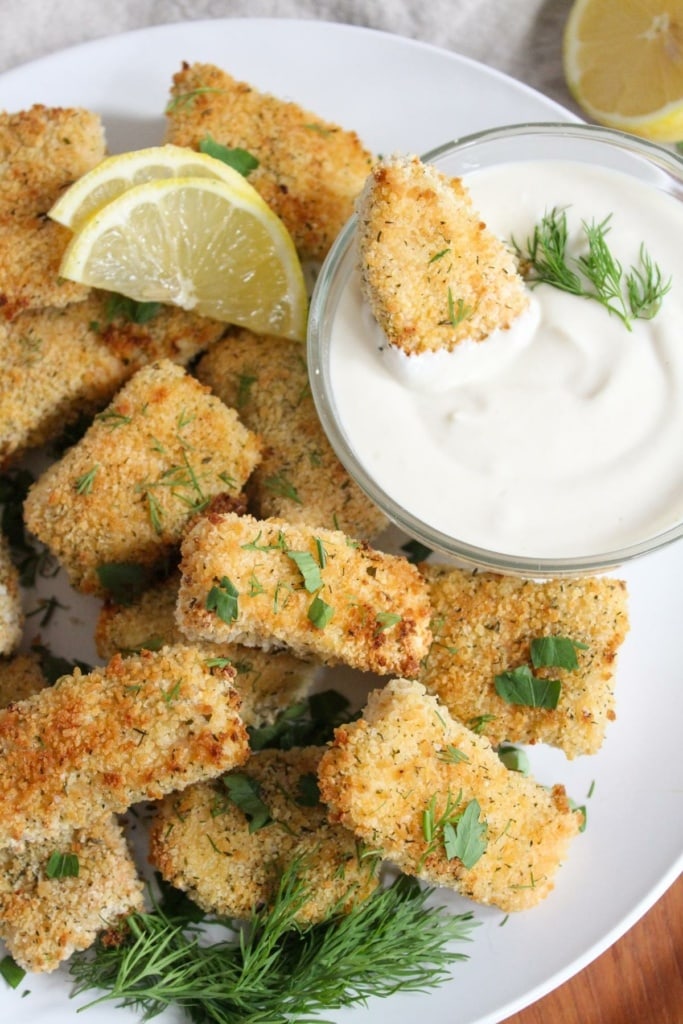 crispy salmon bites with homemade dipping sauce and lemon wedges