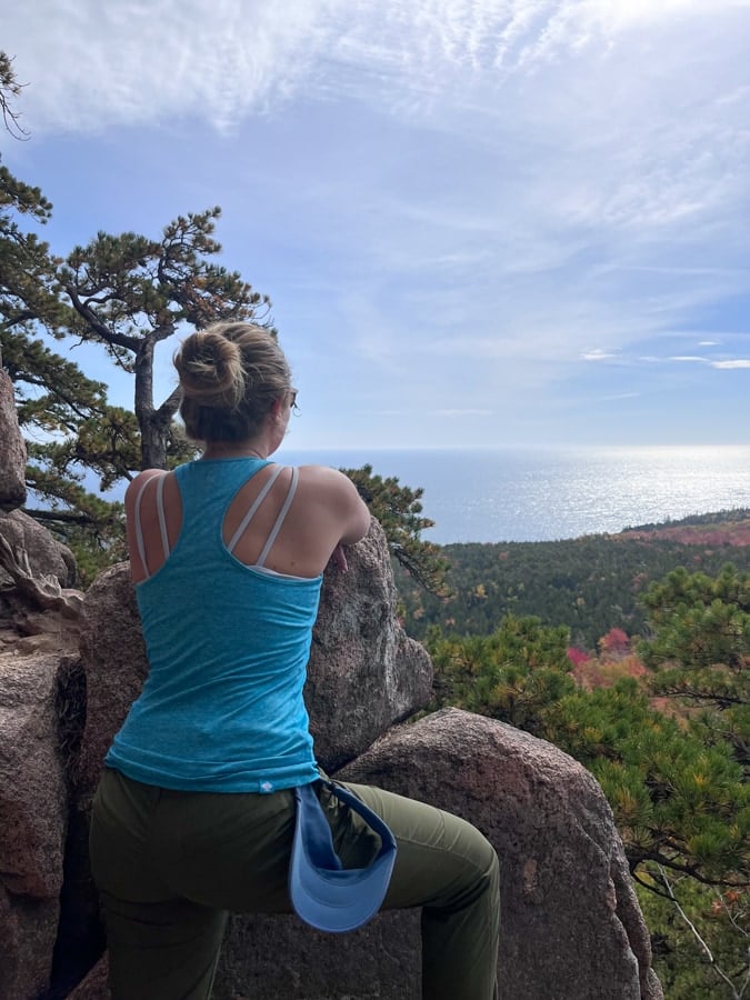 anne mauney taking in the view from the beehive hike in acadia
