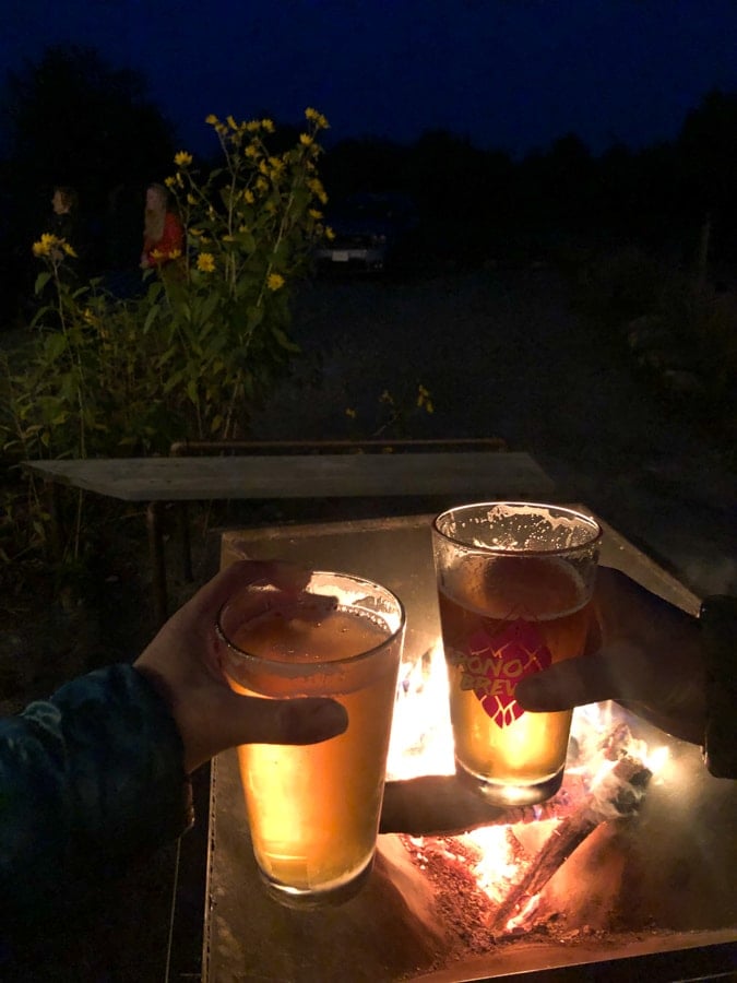 beers by the fire at sweet pea cafe farm