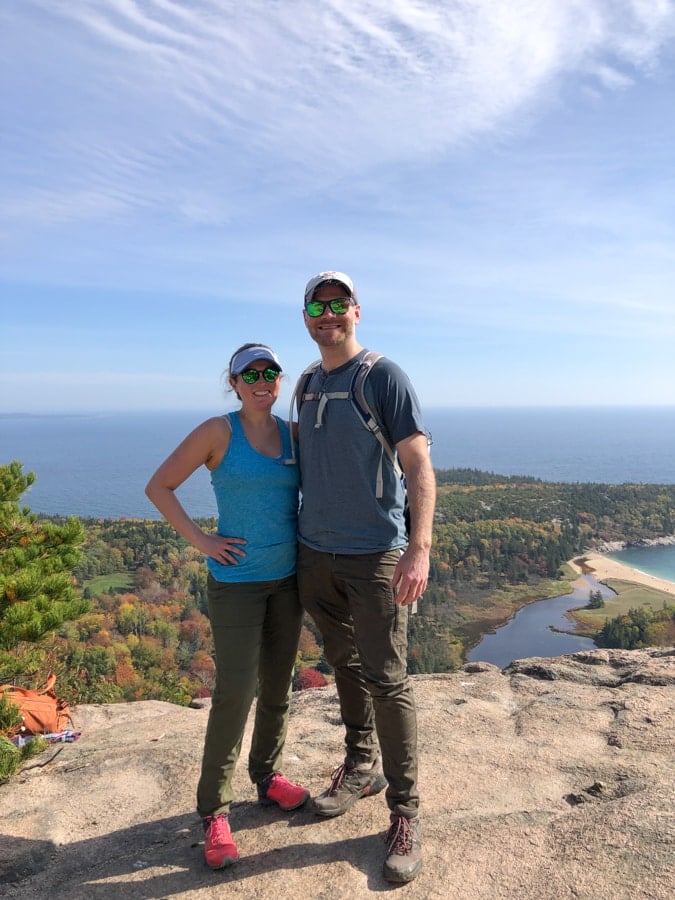 anne and matt mauney at the top of the beehive hike in acadia