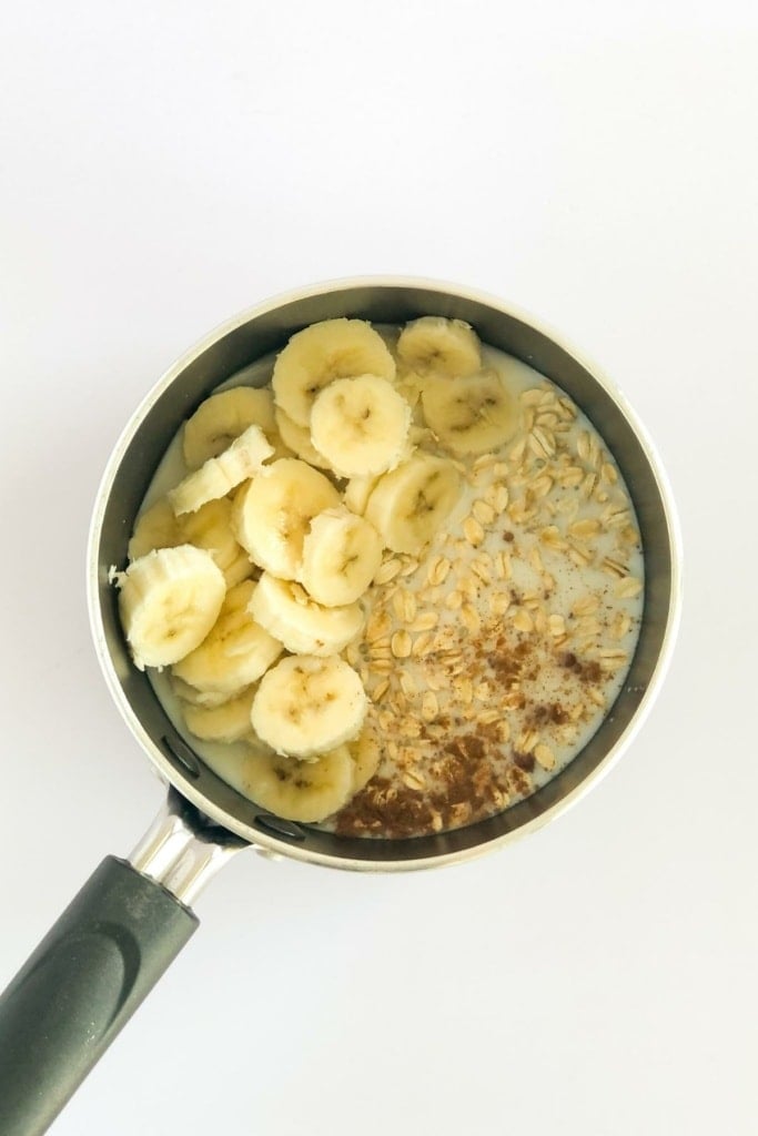 banana slices, milk, and oats in a saucepan