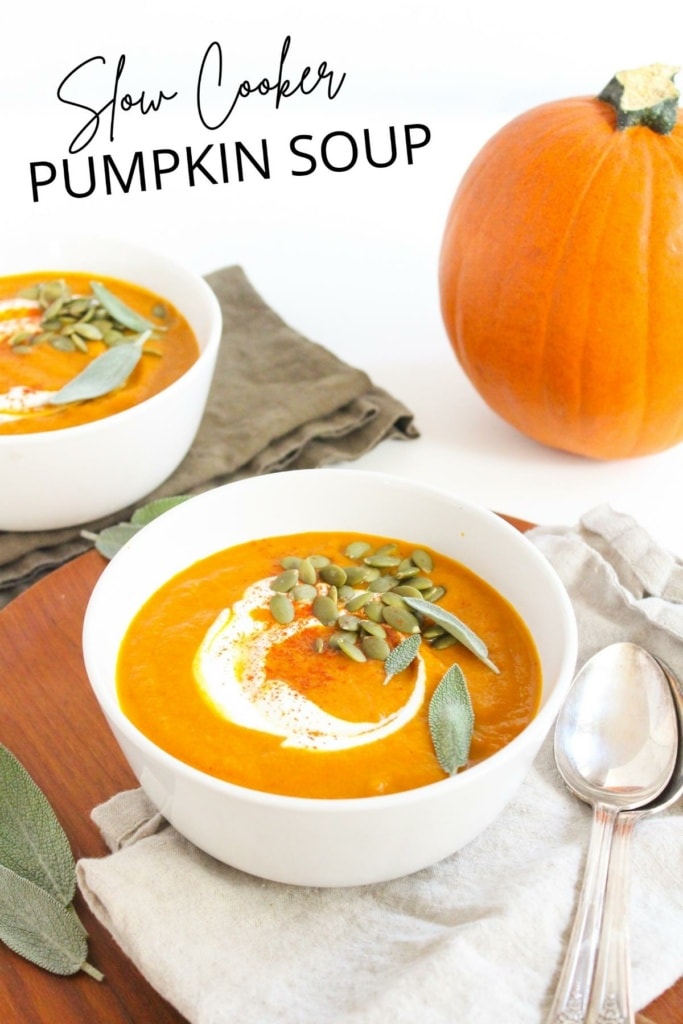 slow cooker pumpkin soup in a bowl with pumpkin seeds