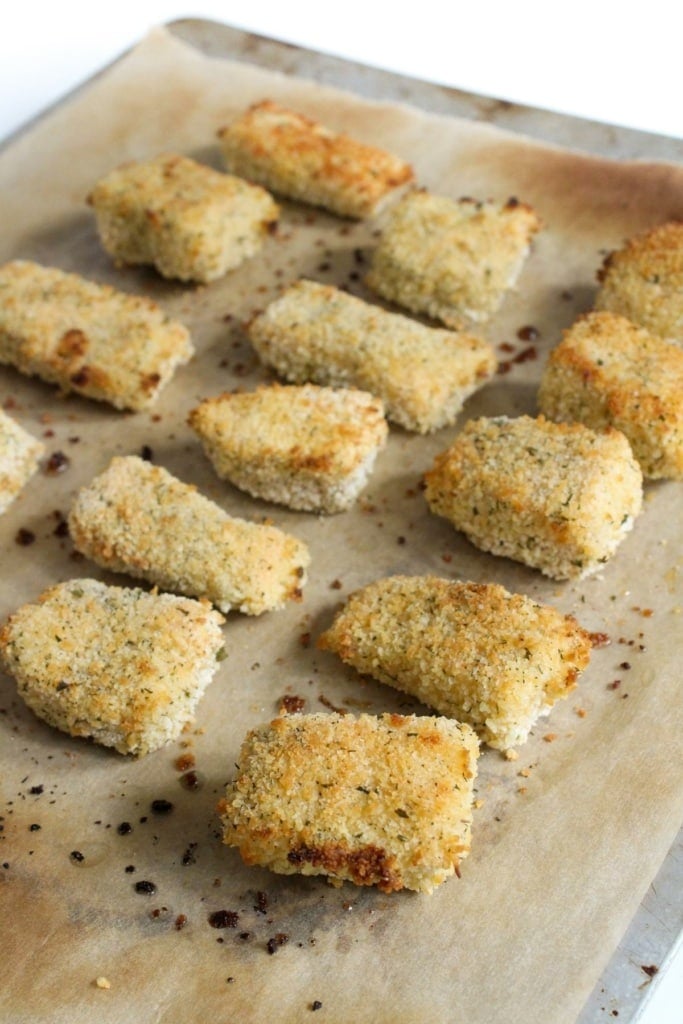 baked salmon cubes on a sheet pan