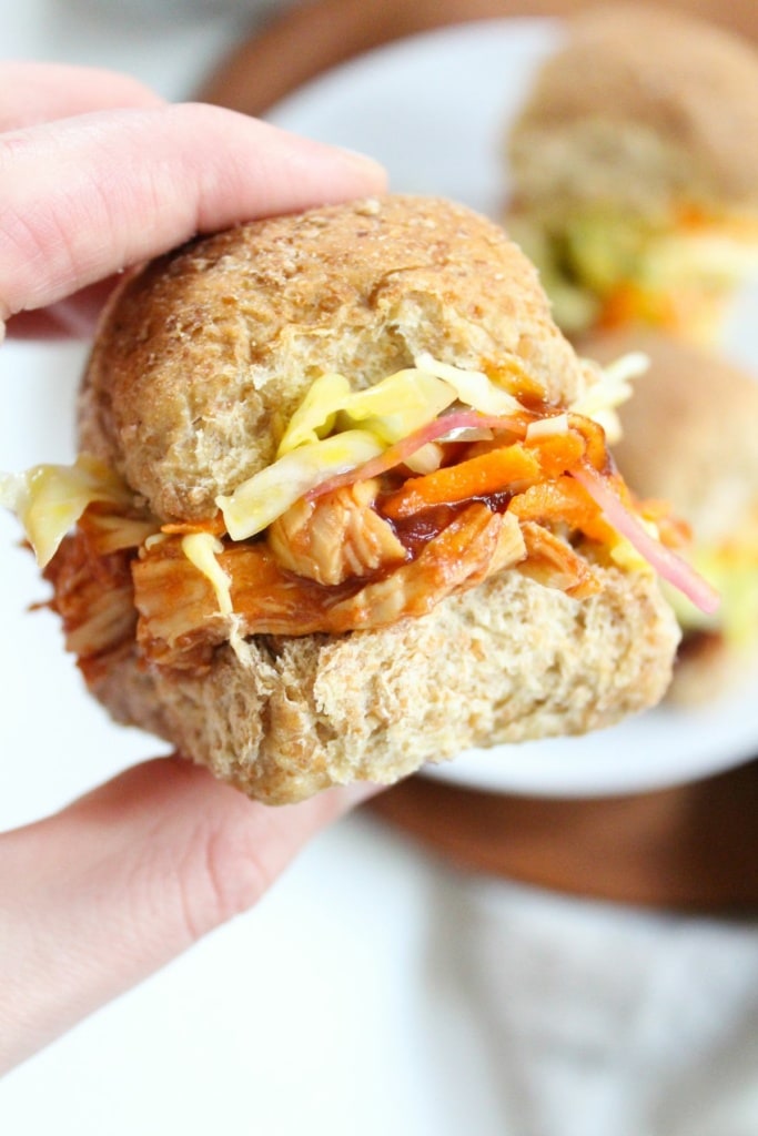 close up of pulled bbq chicken sliders with coleslaw