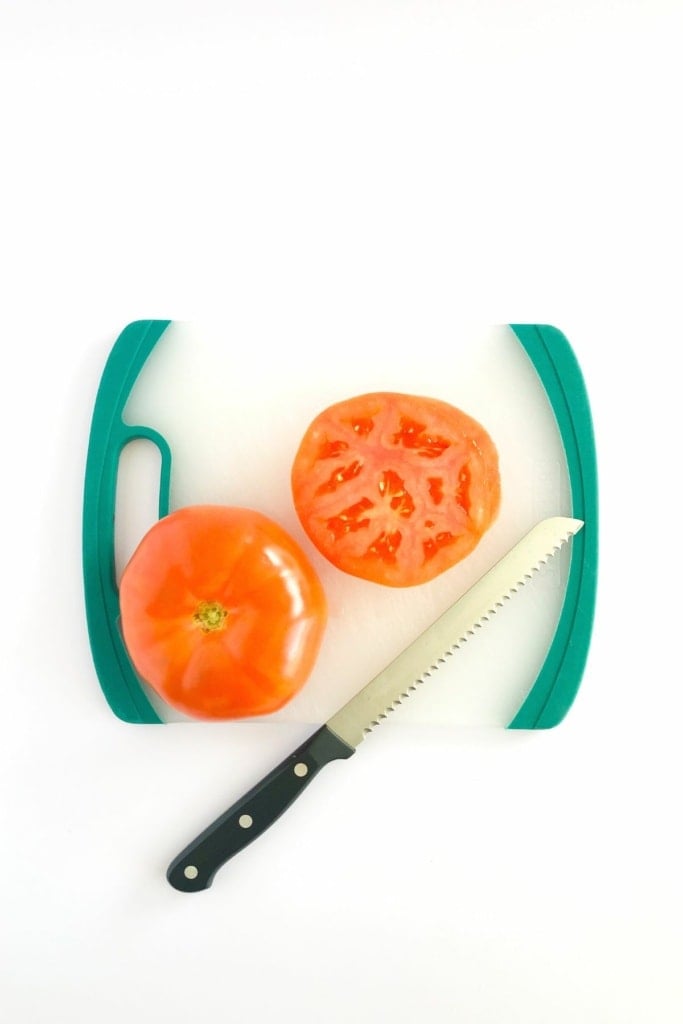 sliced tomatoes on a cutting board