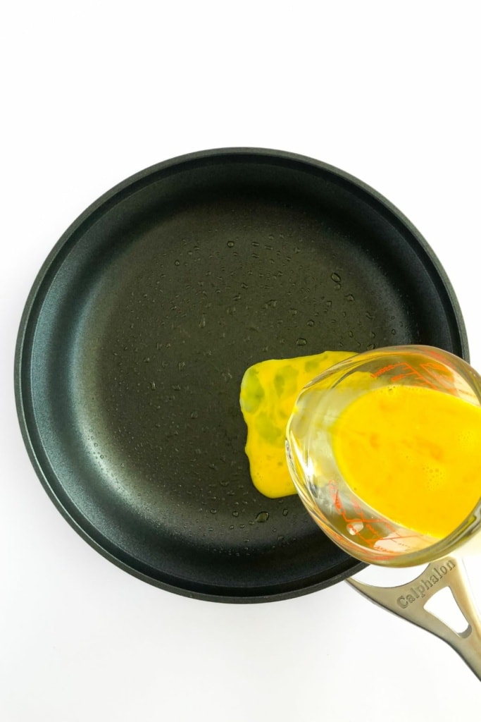 scrambled egg mixture poured onto skillet