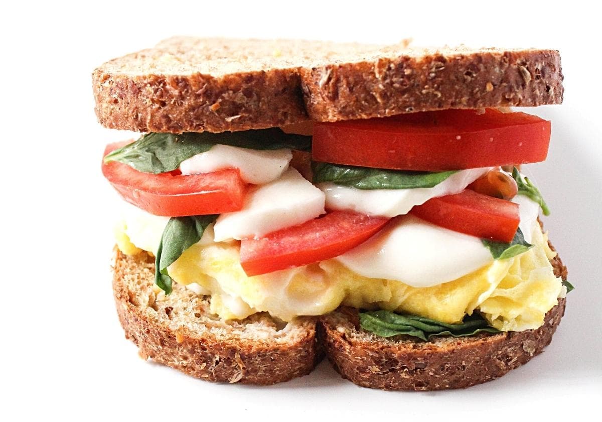 scrambled egg sandwich with tomato and mozzarella