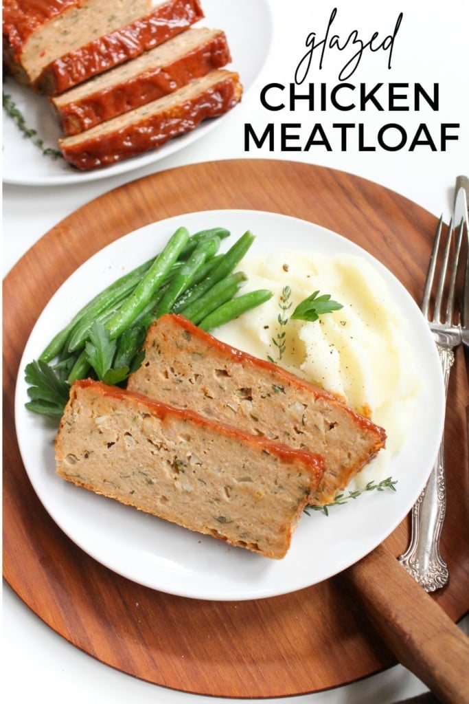 ground chicken meatloaf with glaze on a plate with green beans and mashed potatoes