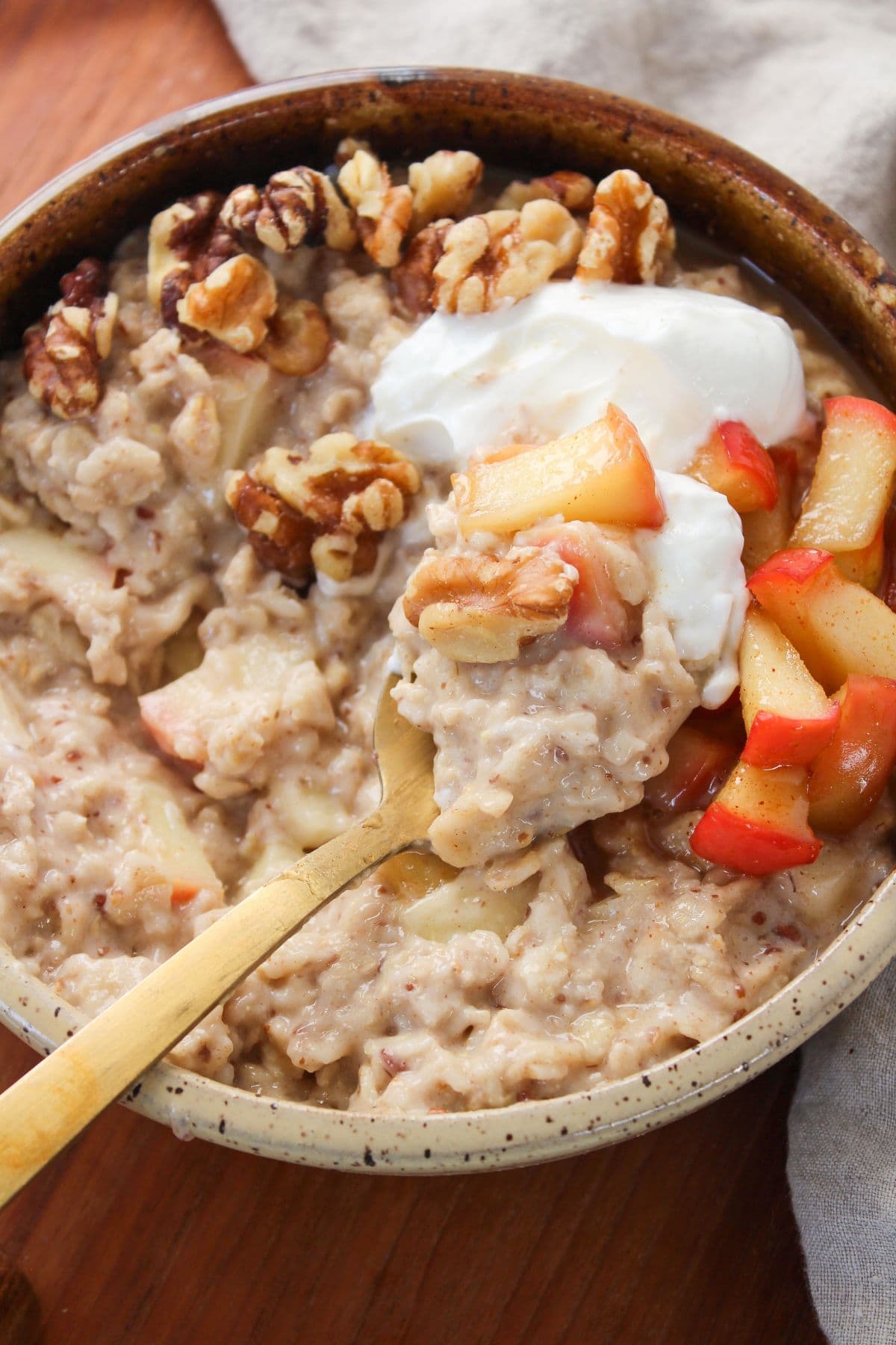 a spoonful of apple oatmeal with greek yogurt