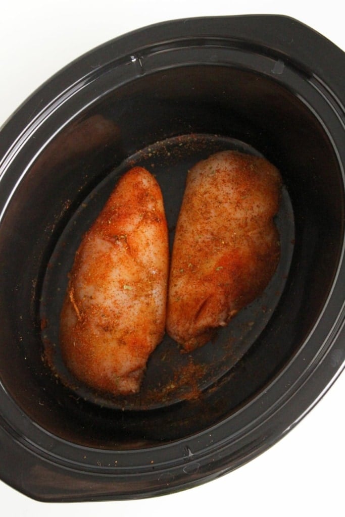 seasoned chicken breasts in a crockpot