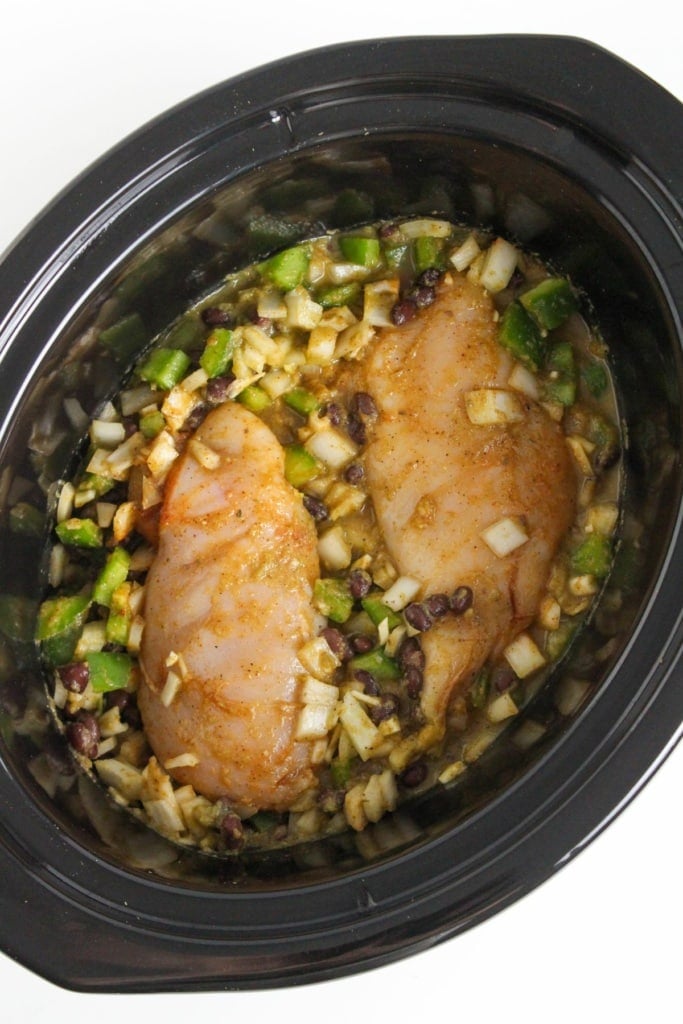 chicken breasts with green peppers and onions in a slow cooker