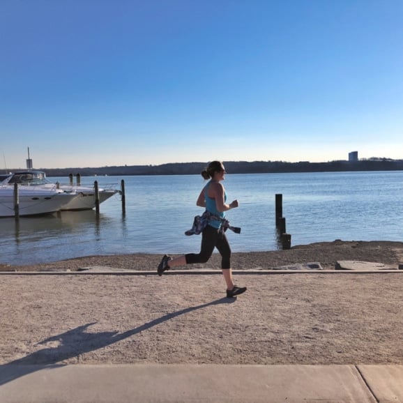 anne mauney running along old town waterfront.