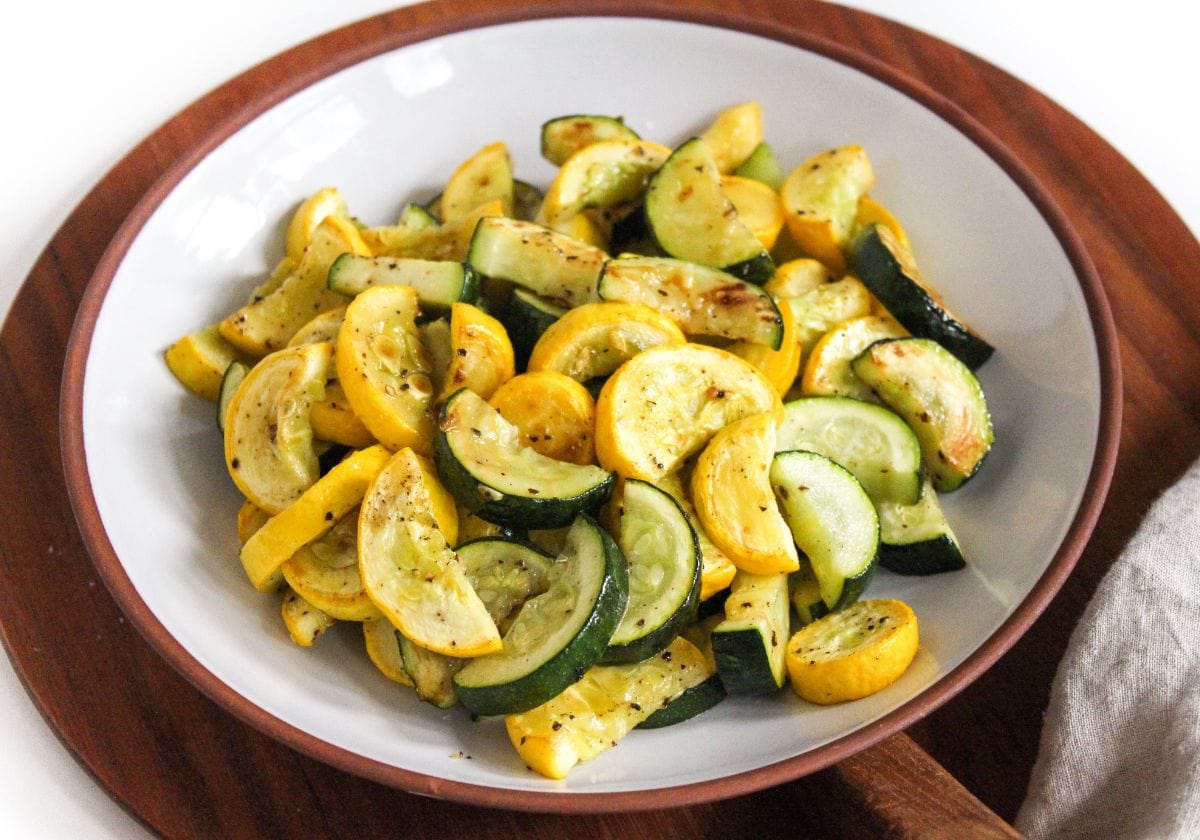 oven roasted sliced zucchini and squash in a large serving bowl