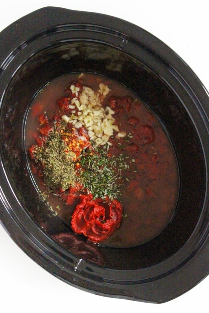 spices and garlic in a slow cooker