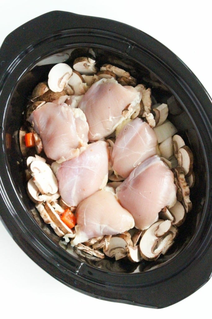 raw chicken thighs in a slow cooker