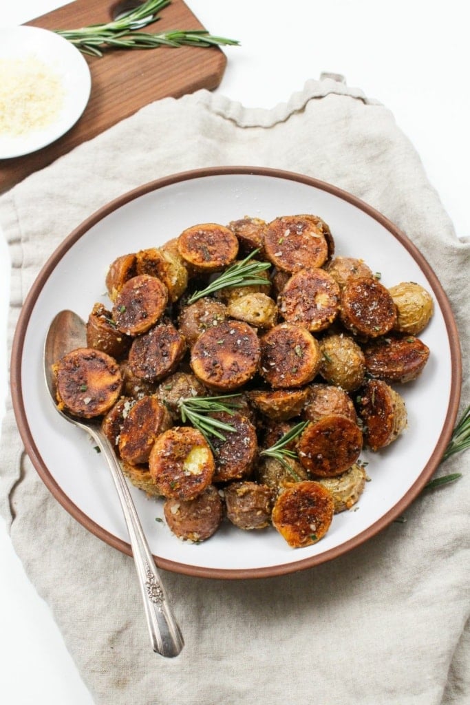 garlic parmesan mini potatoes in a shallow bowl