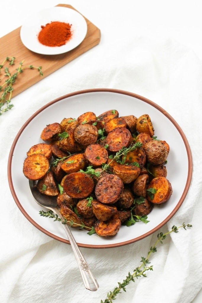 seasoned roasted baby potatoes in a shallow bowl