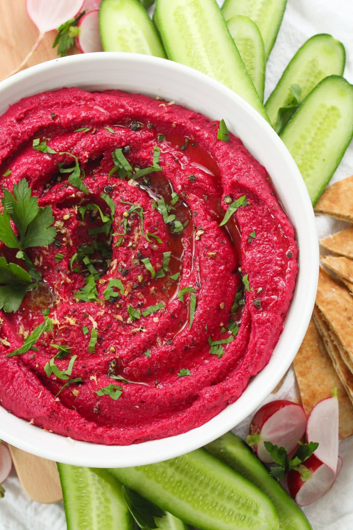 roasted beet tahini dip in a bowl with crunchy vegetables