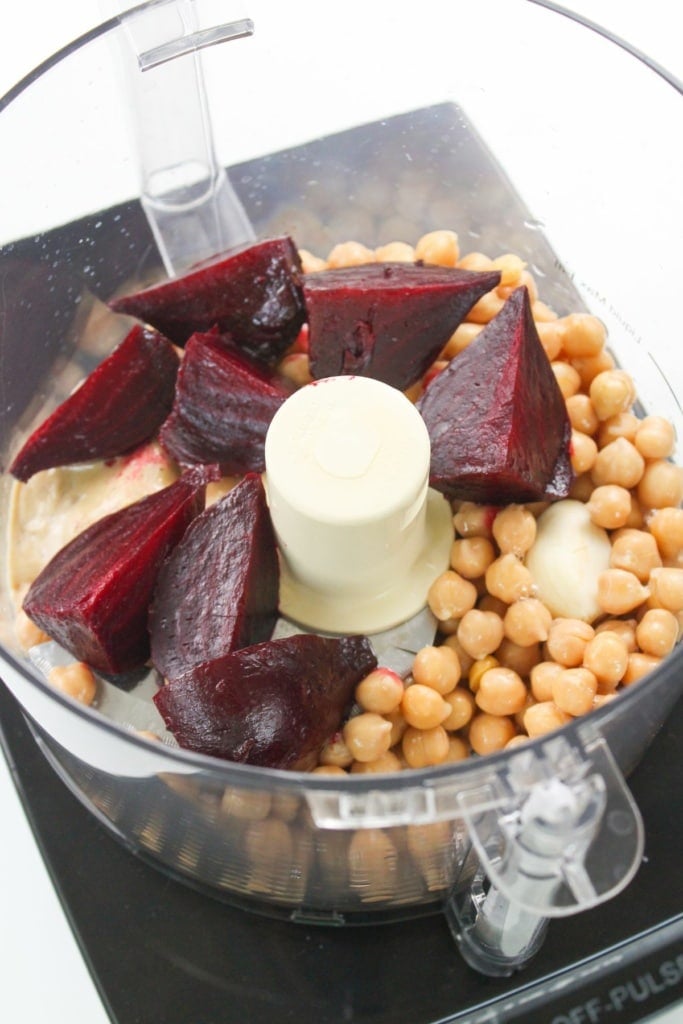 sliced roasted beets with chickpeas and tahini in a food processor