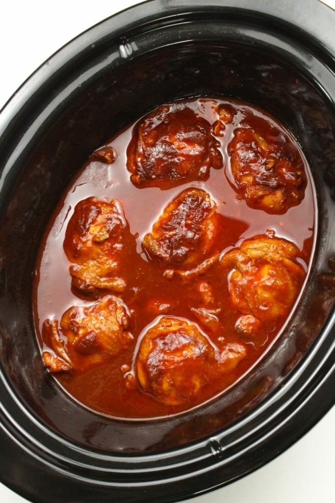 chicken thighs in a crockpot with barbecue sauce